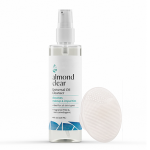 Almond Clear Universal Oil Cleanser in a 4 fl oz spray bottle, shown next to a clear silicone cleansing sponge on a white background.